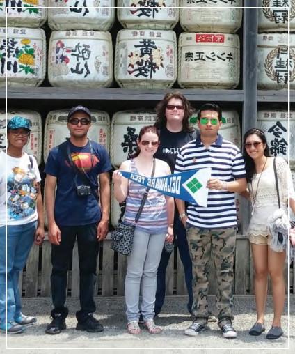 A group of Delaware Tech students posing for a photo on a trip to Japan