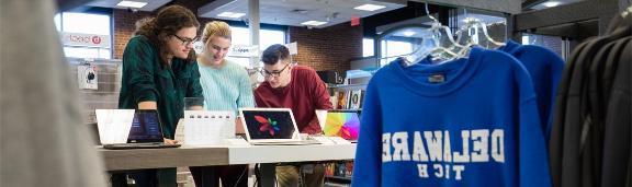 Three students in a Delaware Tech bookstore