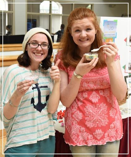 Two students eating ice cream together at a Delaware Tech event